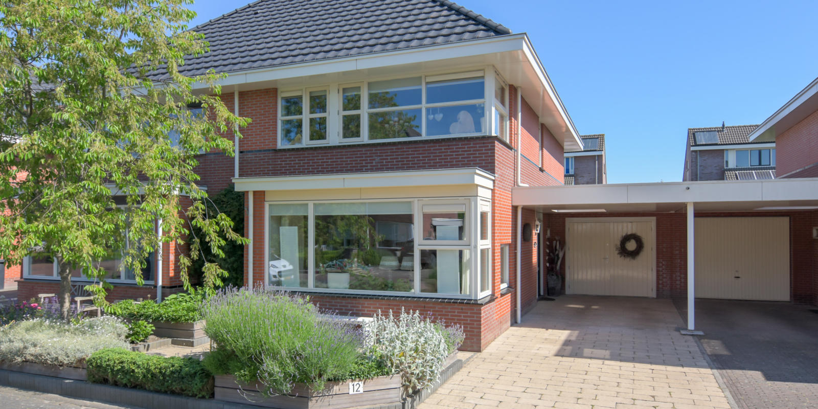 carport tussen 2 woningen